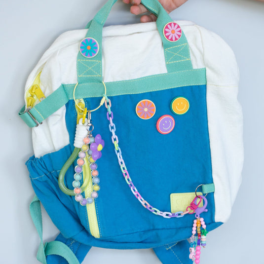 Pin Flor Accesorios Morral Pack and Play