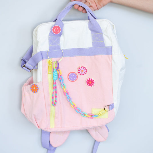 Pin Flor Accesorios Morral Pack and Play